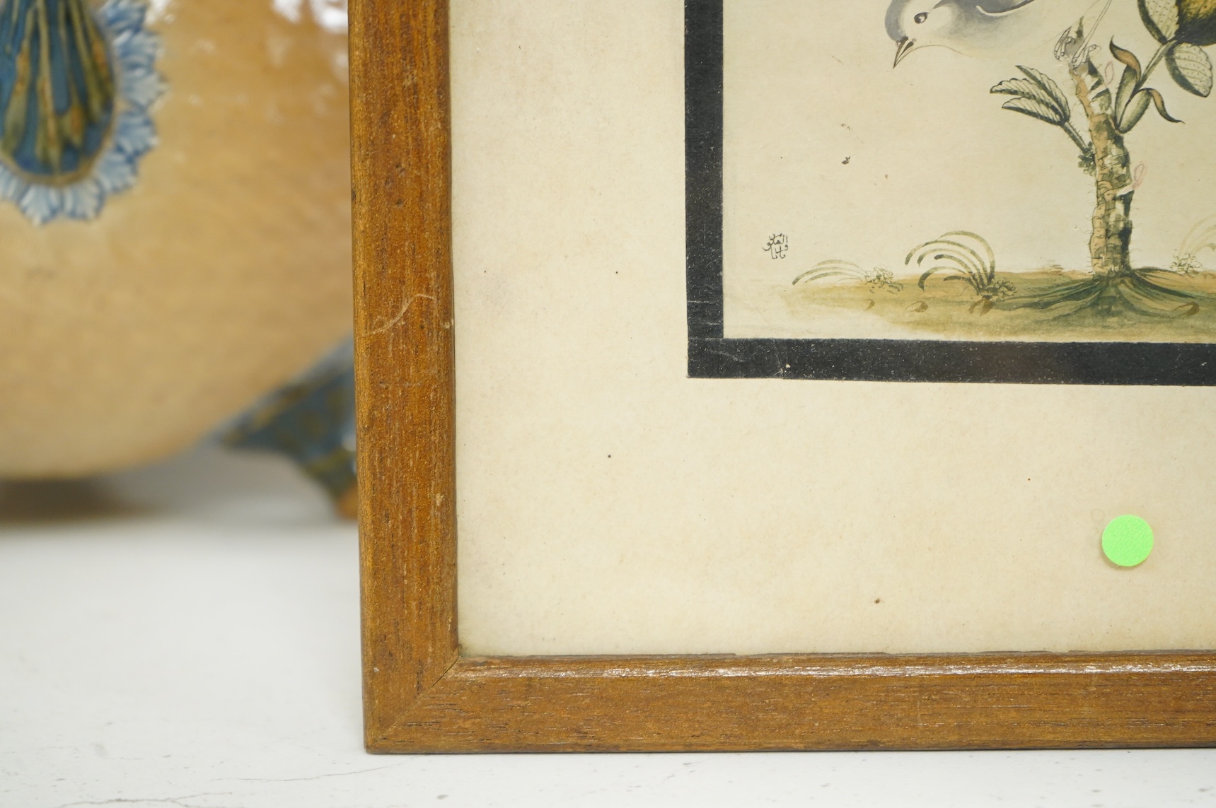 Persian school, Bird amongst flowers, signed, watercolour, 18 x 10cm